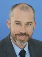Professional headshot of Gehron Treme